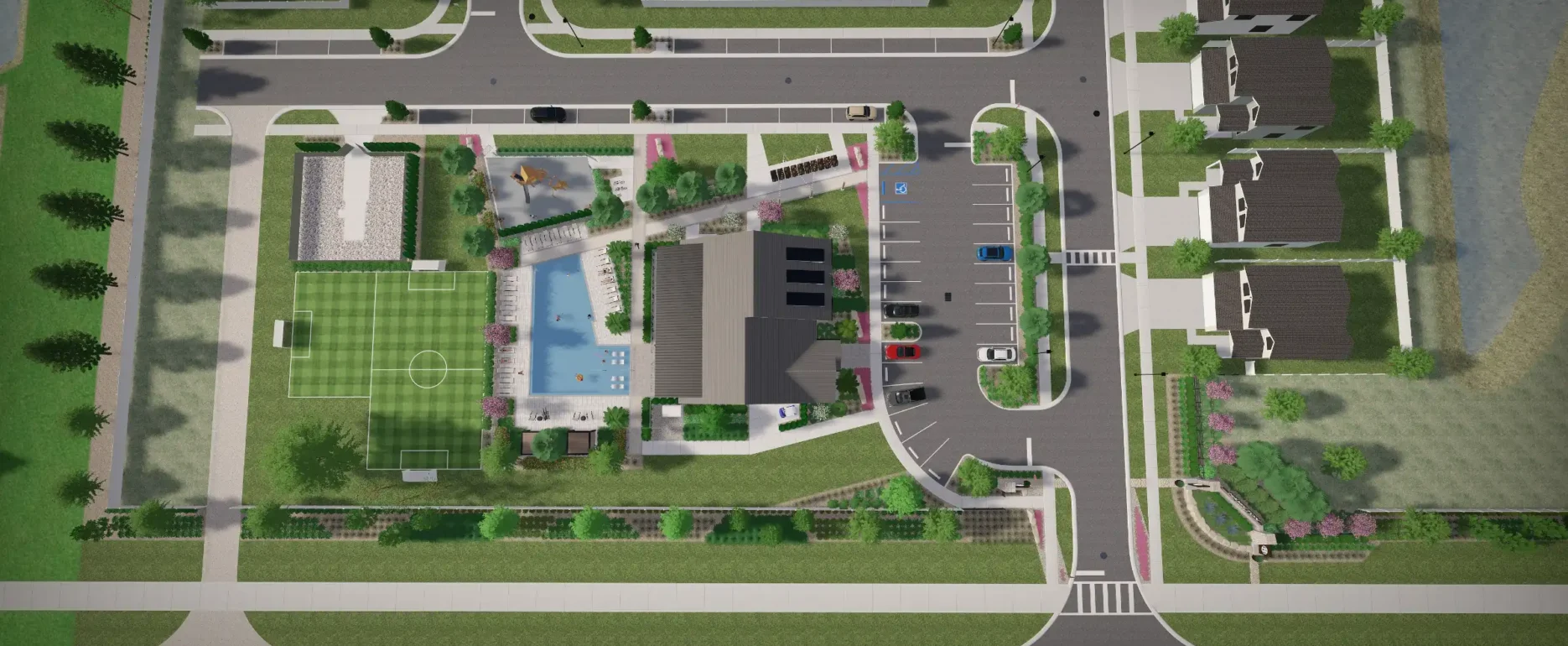 Aerial view of luxury residential community featuring pool, sports field, and manicured landscaping in St Petersburg, FL development.