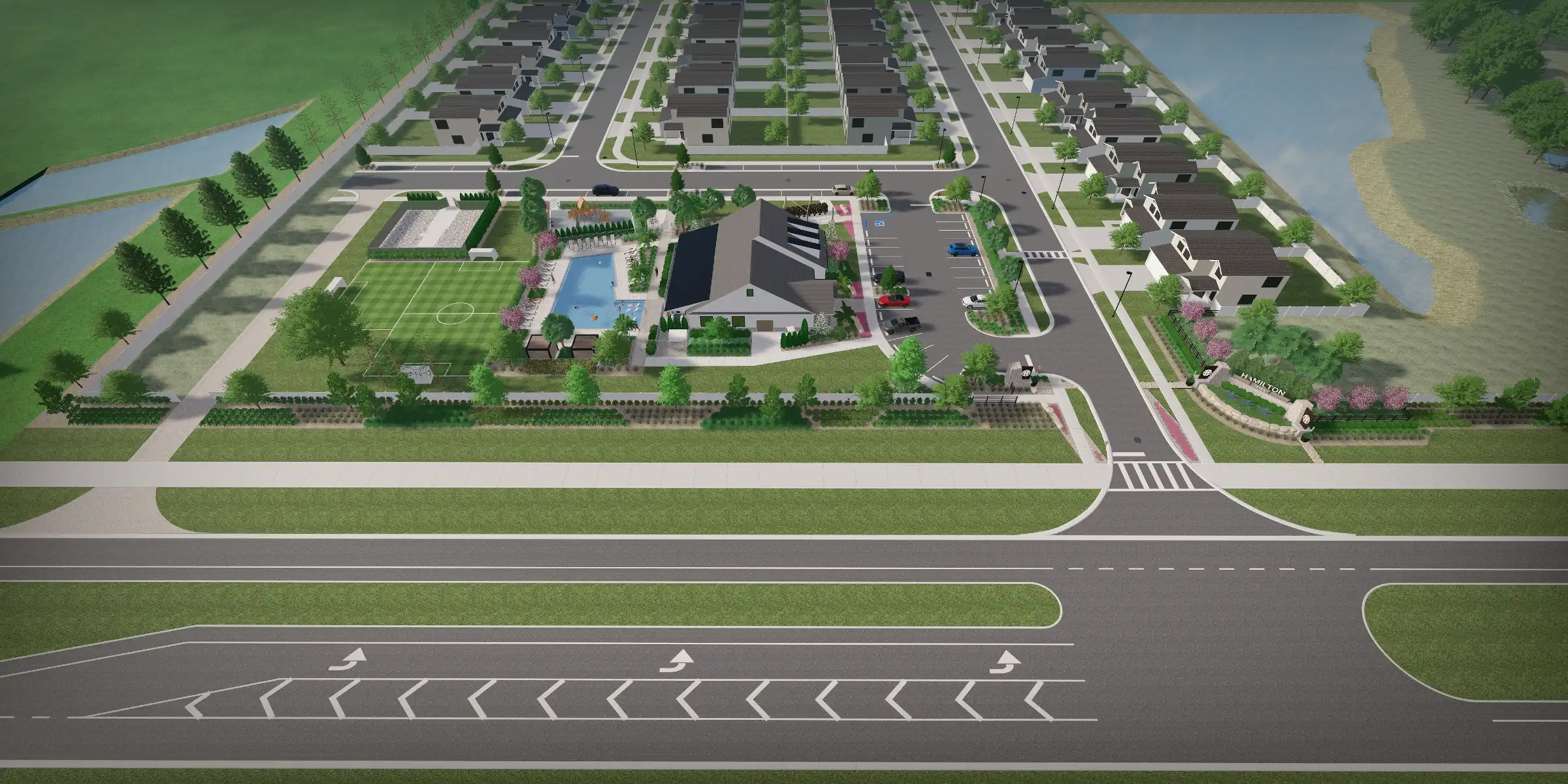 Aerial view of luxury residential community in St Petersburg, FL featuring tree-lined streets, central amenity building with pool, sports fields, and waterfront landscaping.