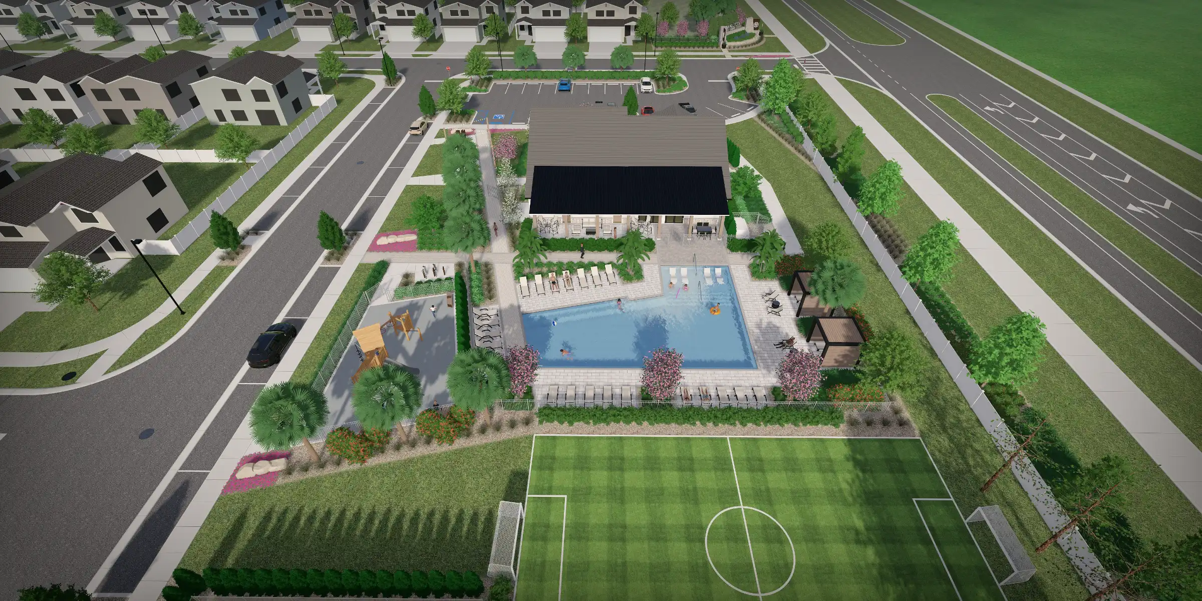 Aerial view of luxury residential community with resort-style pool, clubhouse, sports field, and manicured landscaping in St Petersburg, FL.