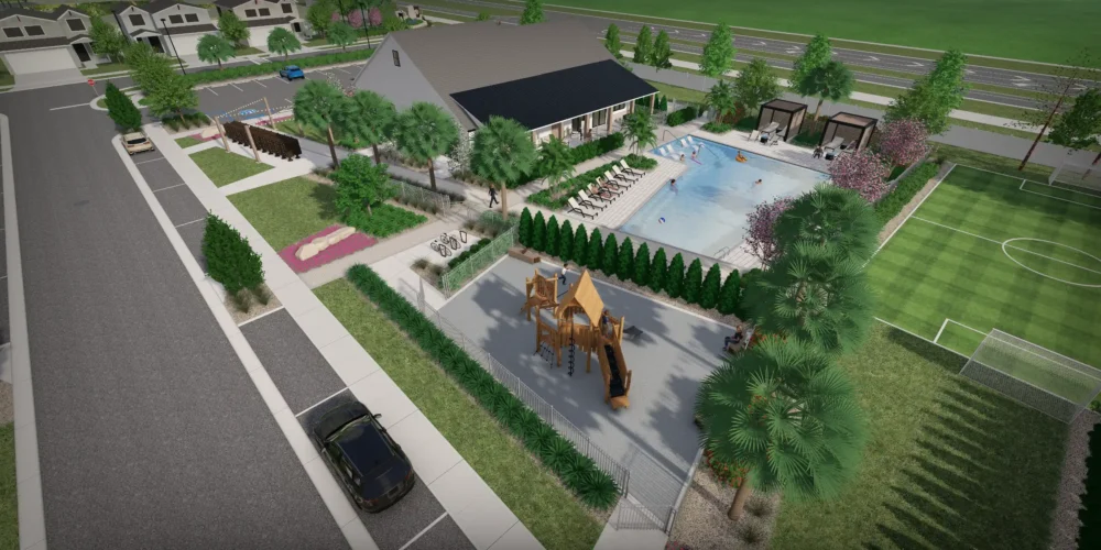 Aerial view of luxury residential community in St Petersburg FL featuring pool, playground, clubhouse, and sports fields surrounded by landscaping.