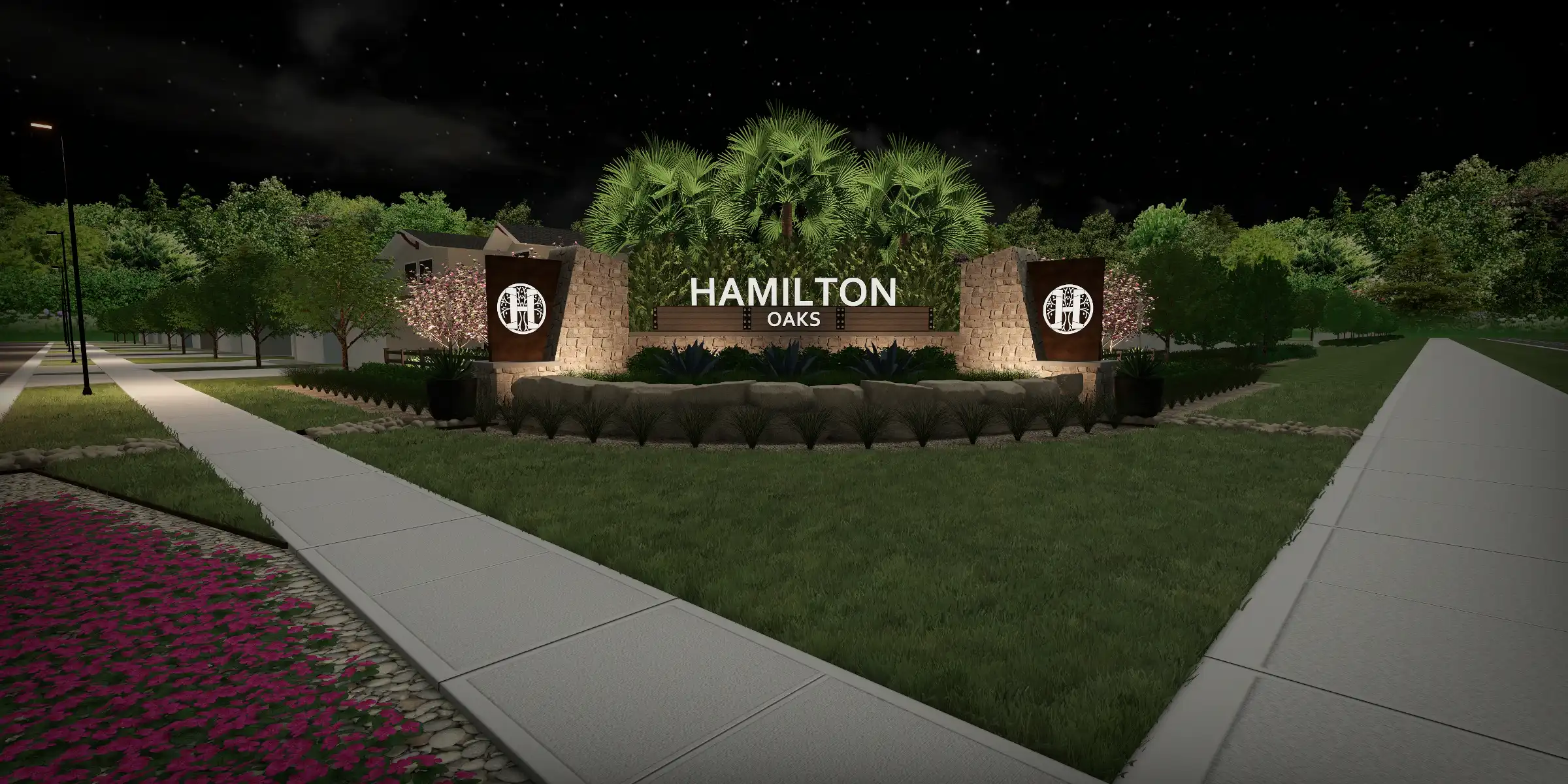Illuminated stone monument sign for Hamilton Oaks residential community at night, featuring palm trees and manicured landscape design in St. Petersburg, FL.