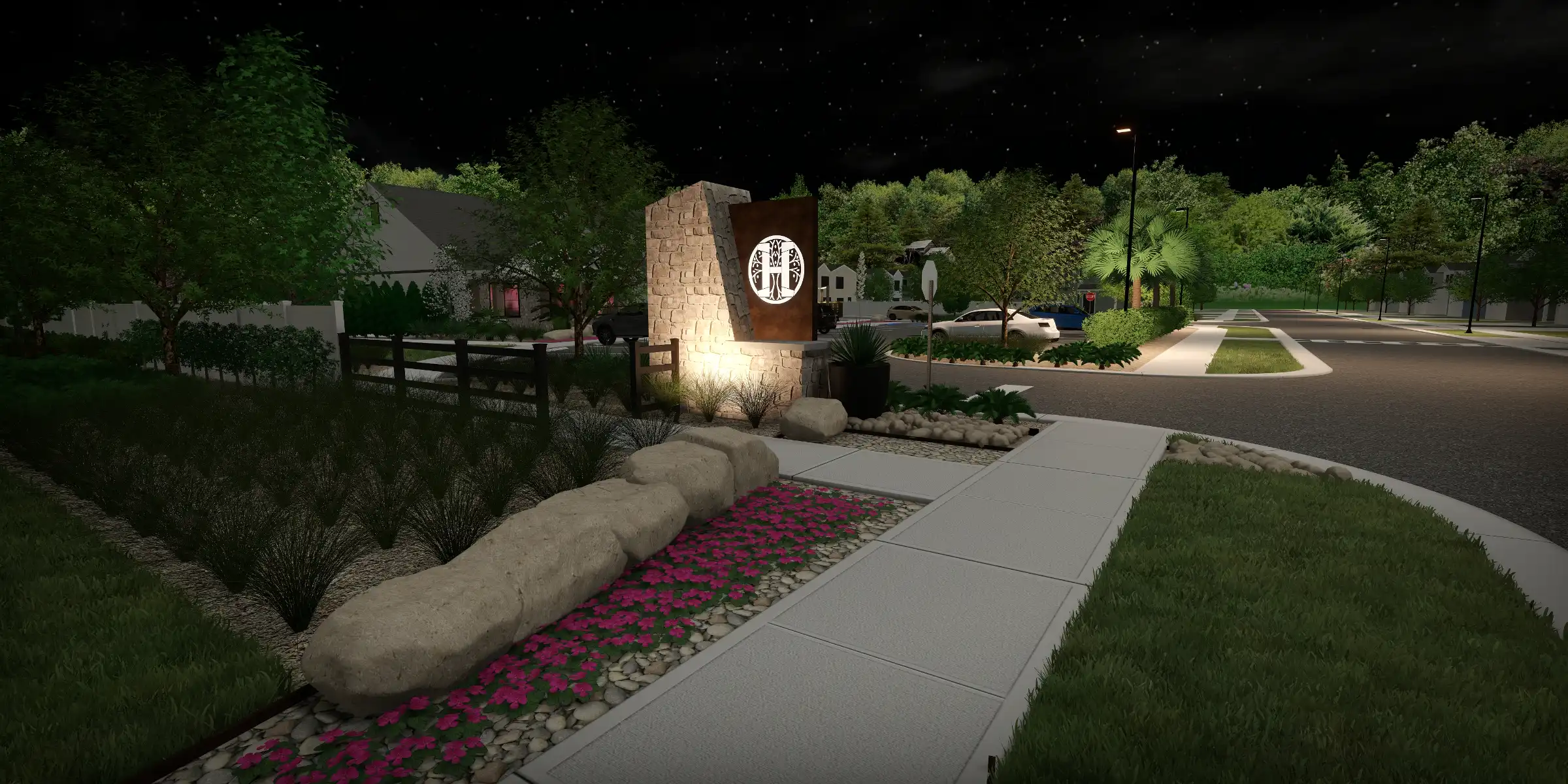 Illuminated stone monument with logo at gated residential community entrance, featuring manicured landscape and street lighting in St Petersburg, FL.