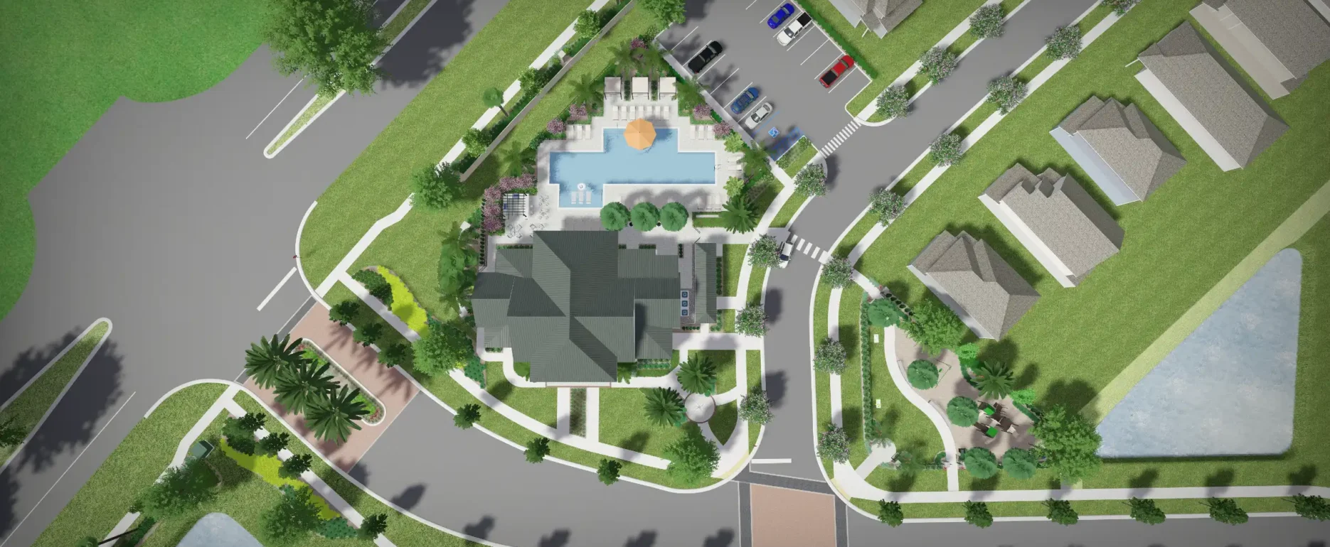 Aerial view of a gated residential community featuring a central clubhouse with pool, surrounding single-family homes, manicured landscaping, and parking areas in St Petersburg, FL.
