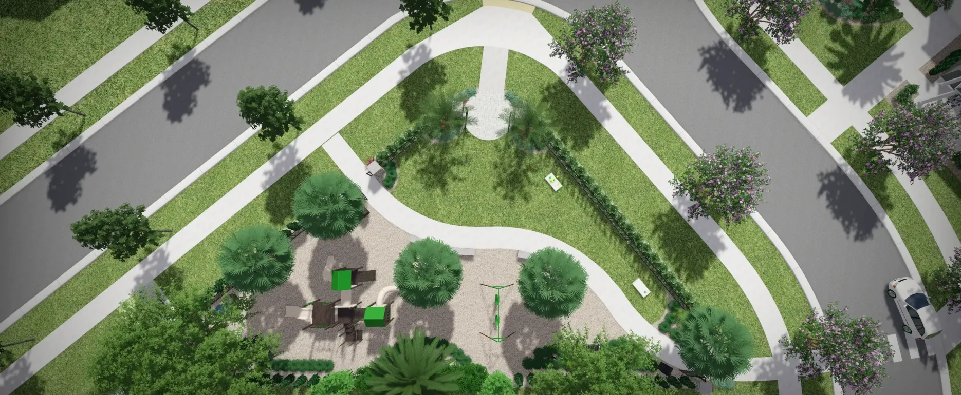 Aerial view of luxury residential community in St Petersburg with curved streets, manicured lawns, palm trees, and central plaza with seating areas.