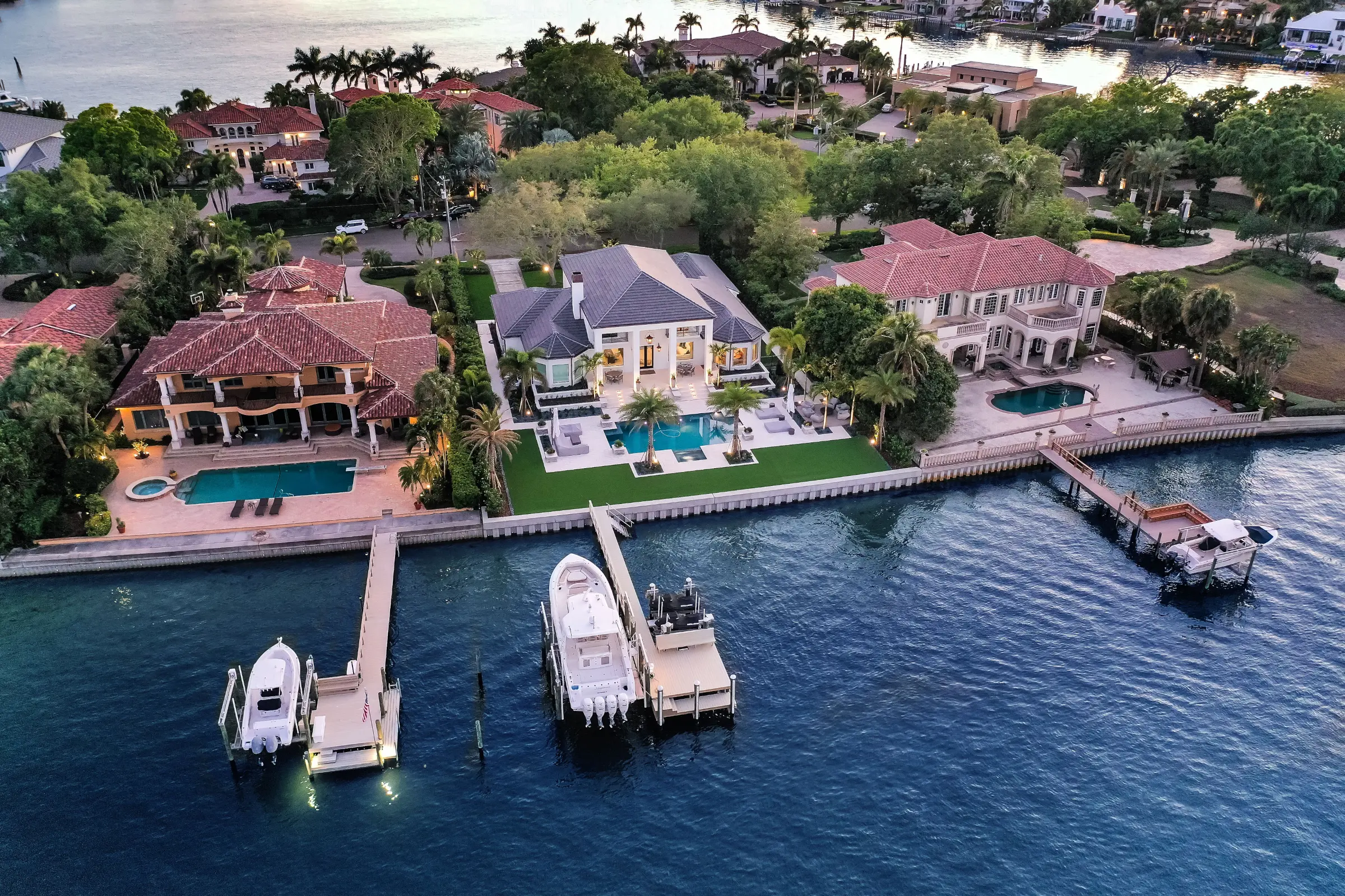 Luxury waterfront home with pool and boat dock in St Petersburg, Florida showcasing premium residential landscape design and outdoor construction.